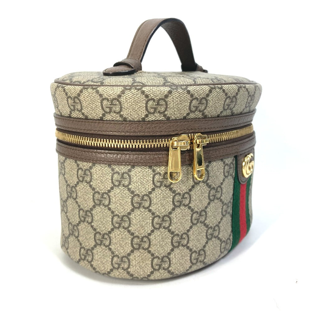 Designer handbag with monogram pattern and gold zipper on a white background