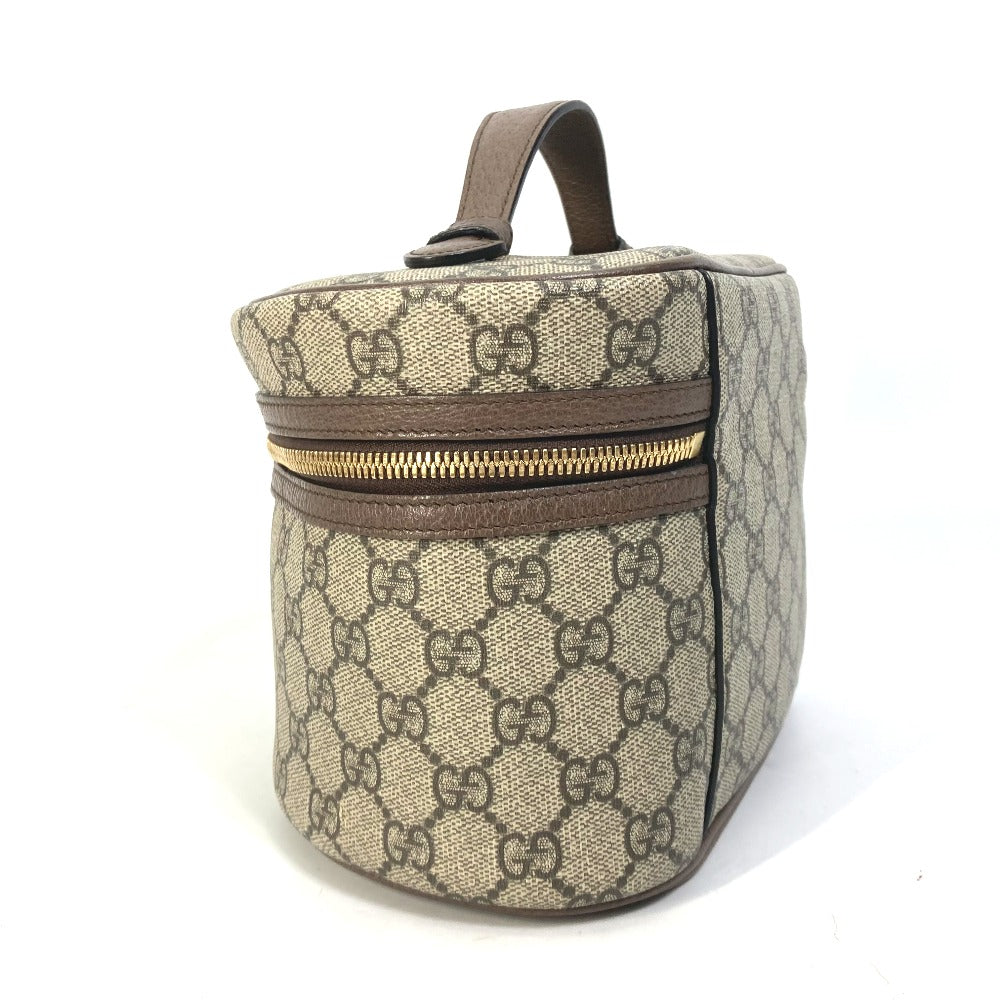 Gucci patterned bag with brown accents on a white background