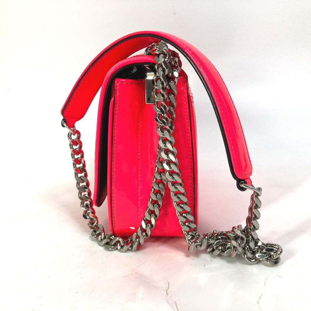 Pink handbag with a silver chain strap on a white background
