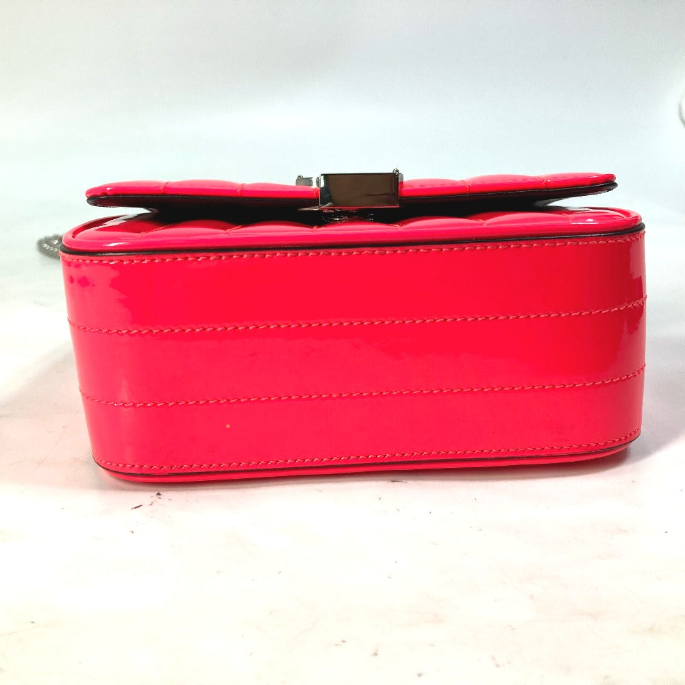 Red handbag with a gold clasp on a white background