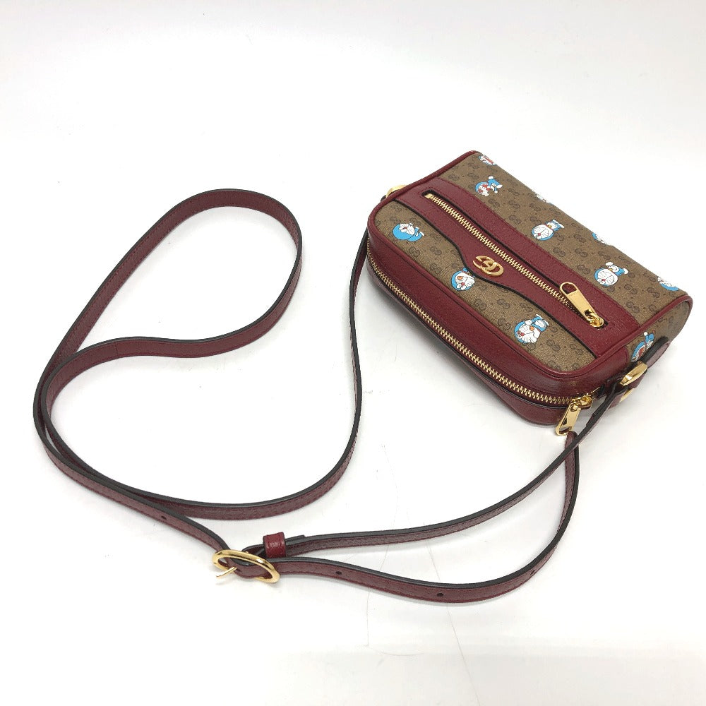 full front Gucci X DORAEMON Mini Vintage GG Supreme Monogram Camera Bag
