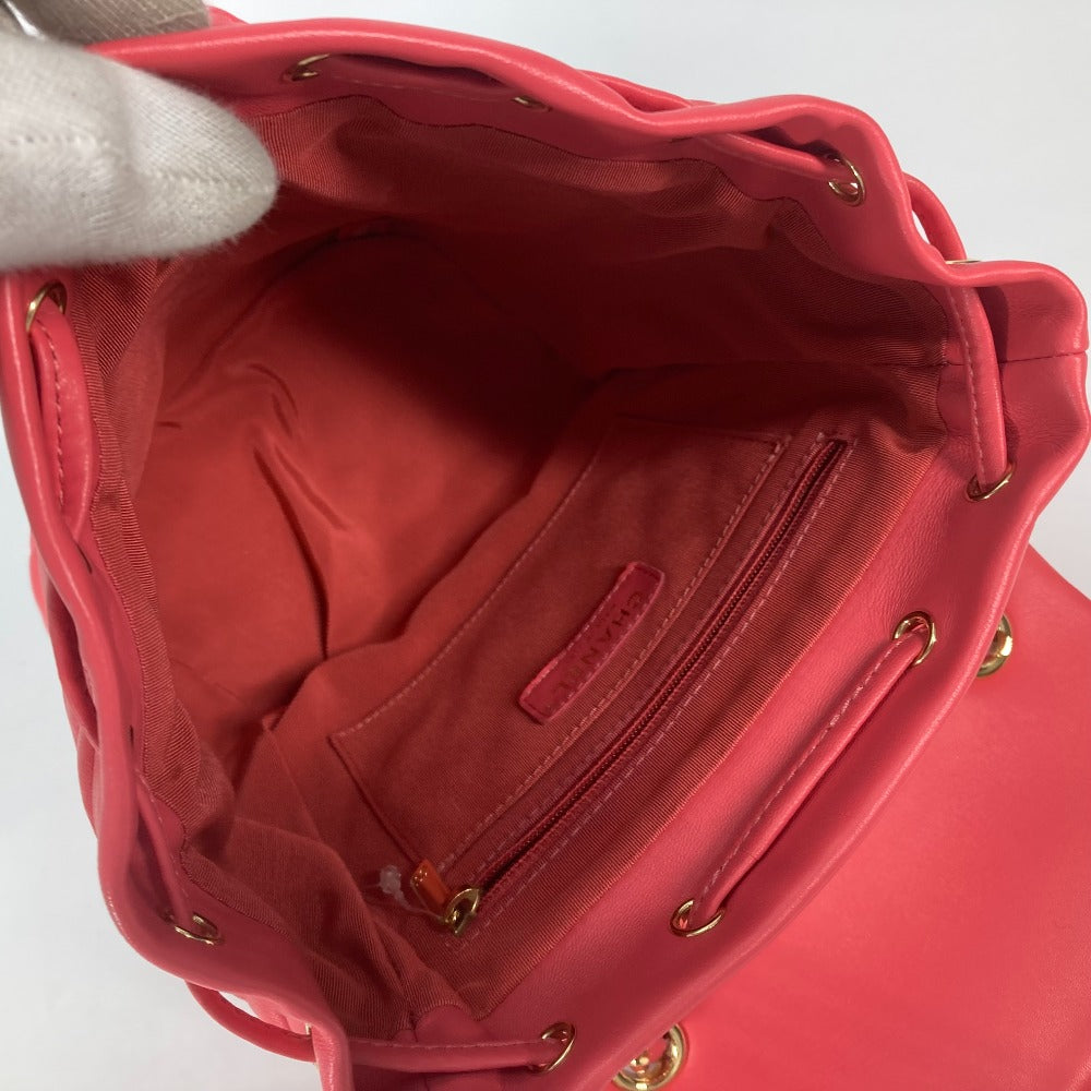 Red handbag with gold accents on a white background