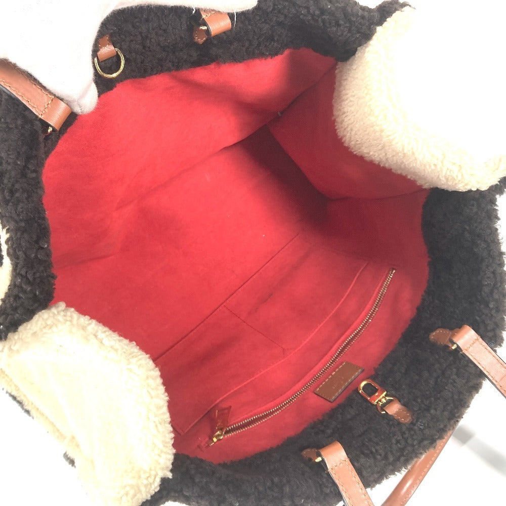 interior Louis Vuitton Shearling Monogram On The Go GM Black and White