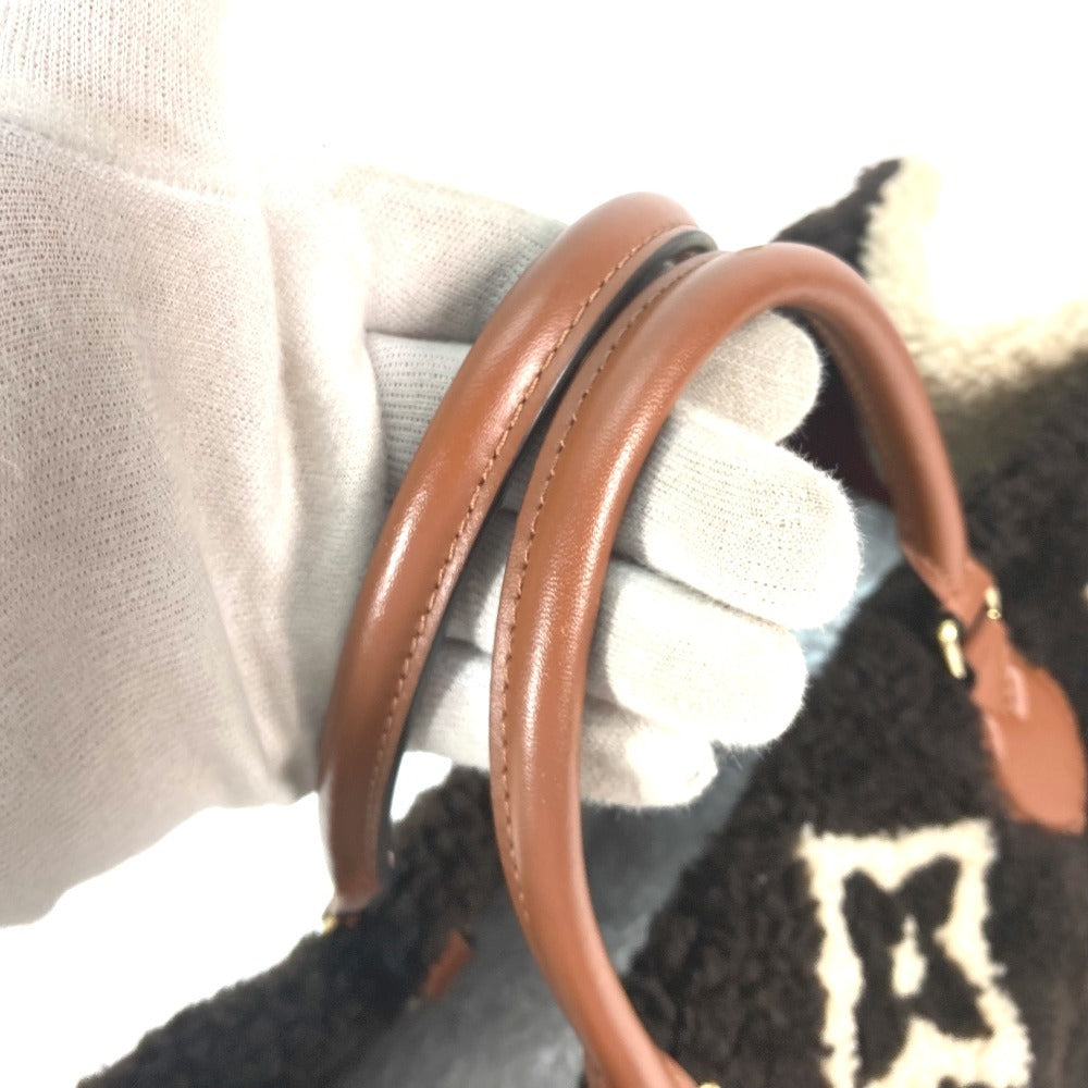 brown handles Louis Vuitton Shearling Monogram On The Go GM Black and White