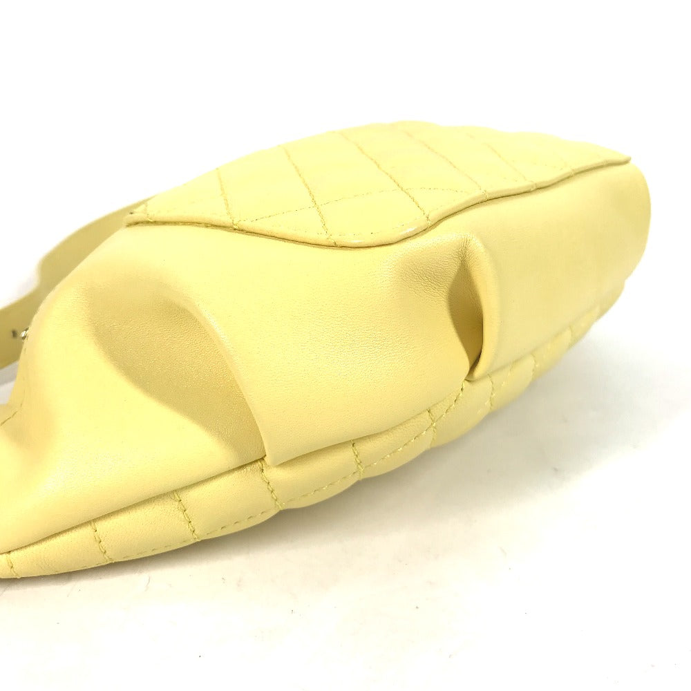 Yellow quilted slipper on a white background
