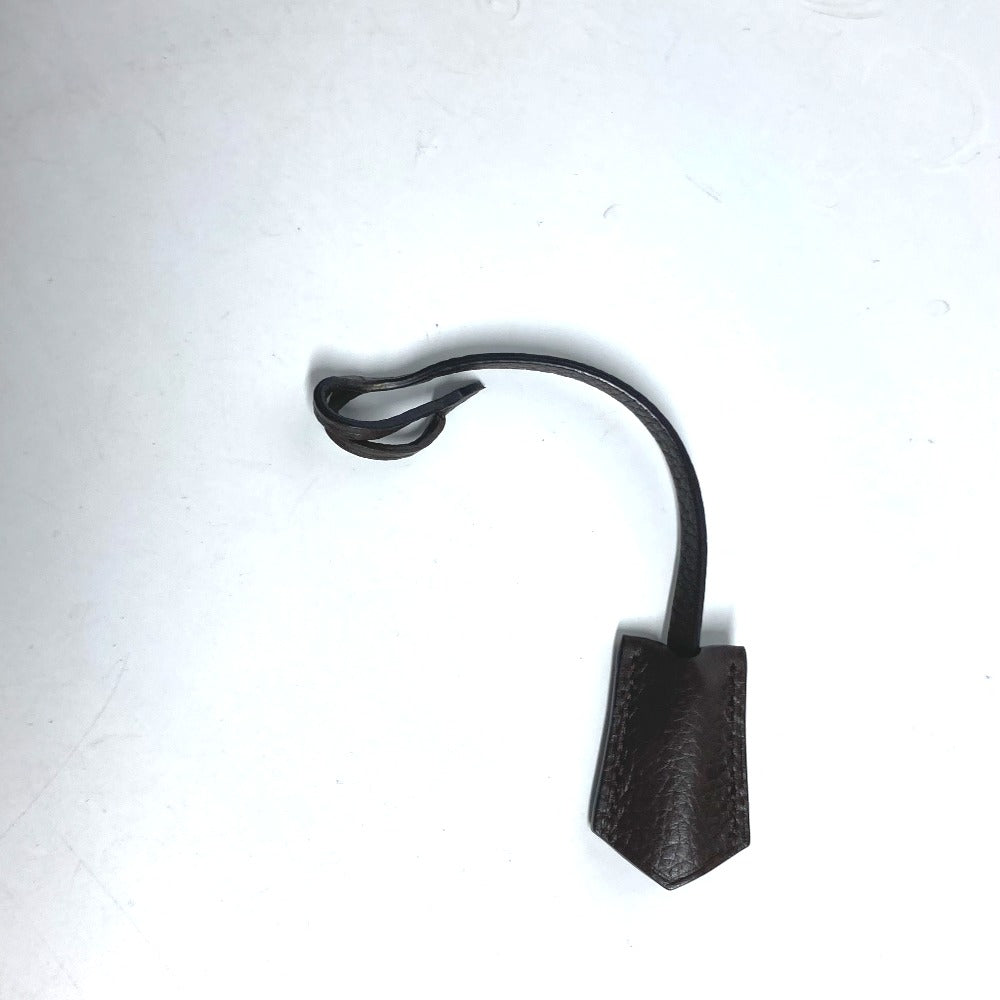 Black metal lamp with a curved arm on a white background