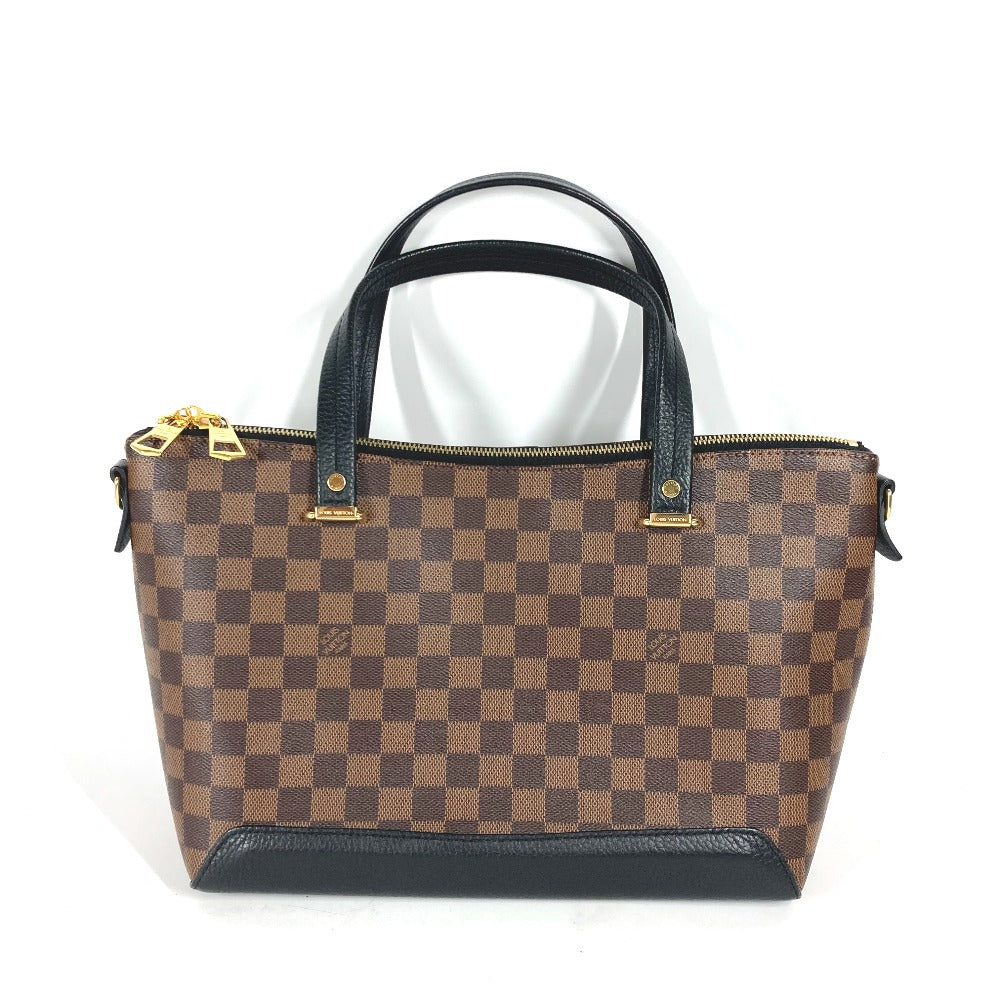 Brown checkered handbag with black handles on a white background
