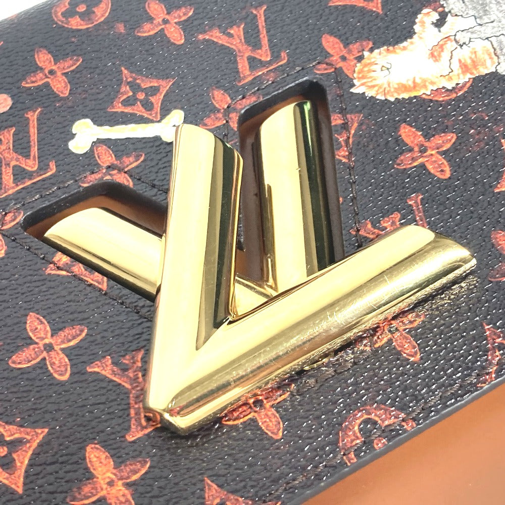 Close-up of a gold 'V' logo on a patterned background