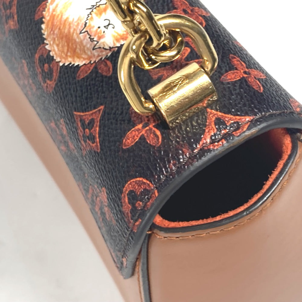 Close-up of a handbag with a gold clasp on a white background