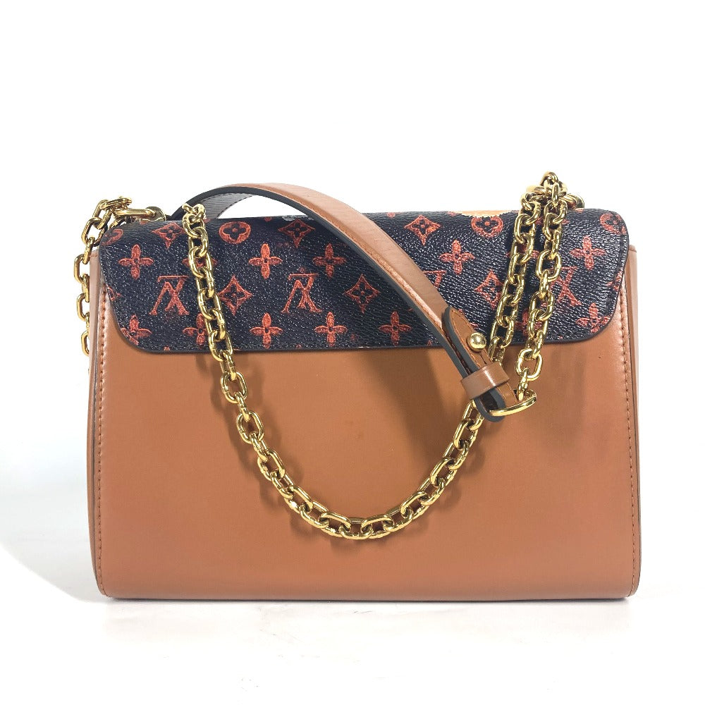 Brown handbag with gold chain and patterned flap on a white background