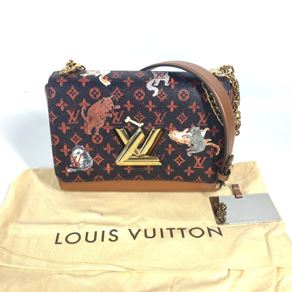Louis Vuitton handbag with patchwork design on a Louis Vuitton dust bag.