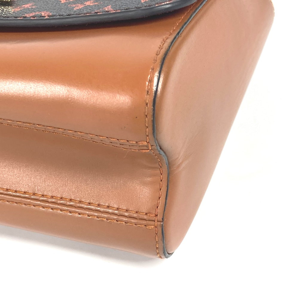 Close-up of a brown leather clutch bag with visible stitching on a white background