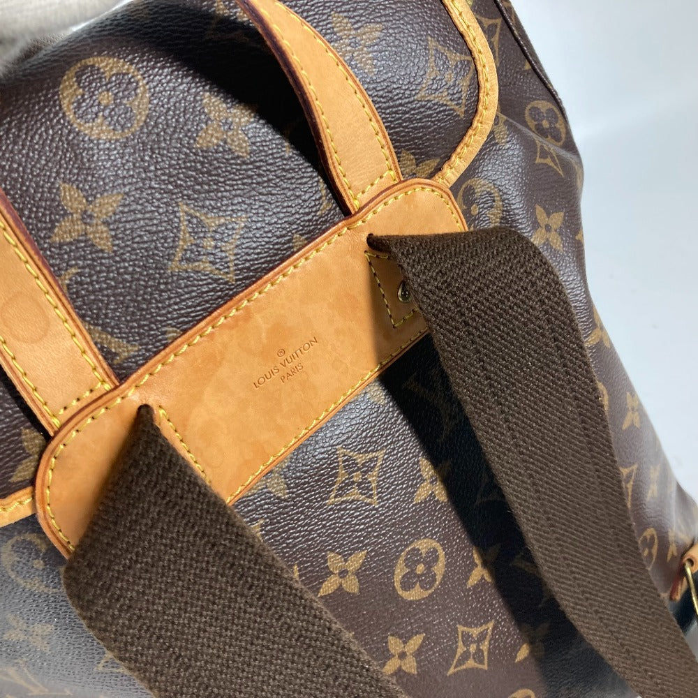 Close-up of a Louis Vuitton monogram bag with visible brand logo.