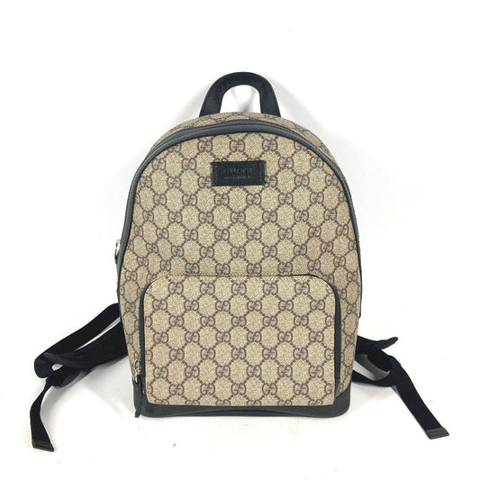 Beige backpack with black pattern on a white background