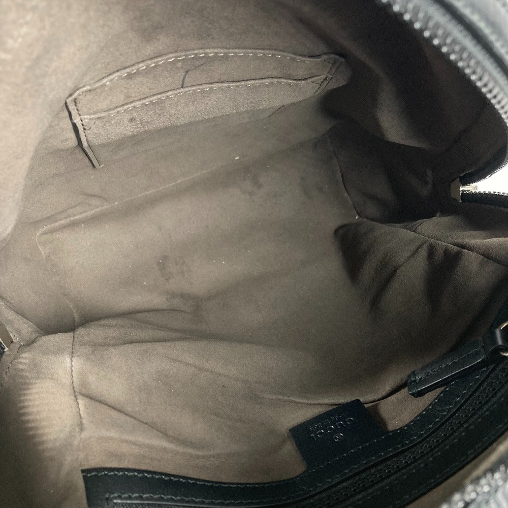 Close-up of a gray jacket with a brand label.