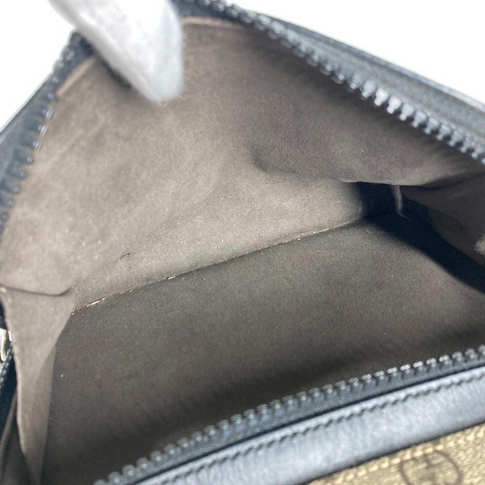 Close-up of a gray leather bag with visible stitching