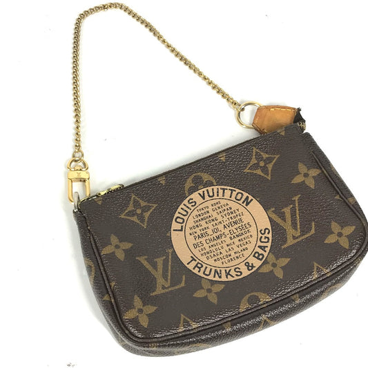 Louis Vuitton handbag with monogram pattern on a white background