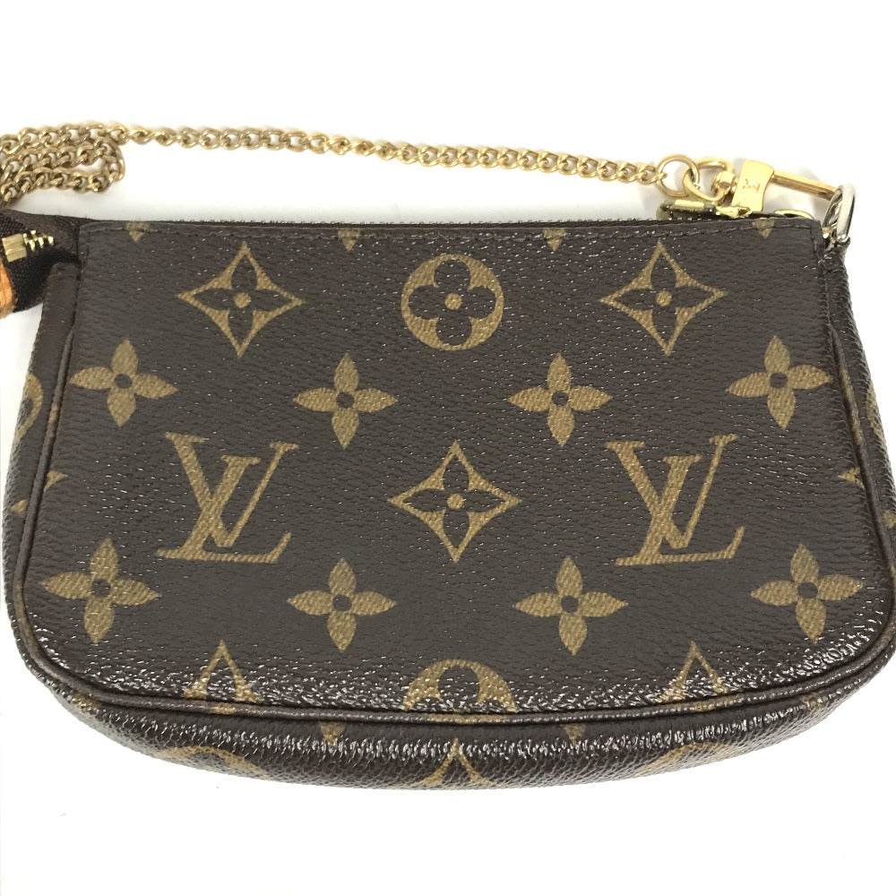 Louis Vuitton handbag with monogram pattern on a white background