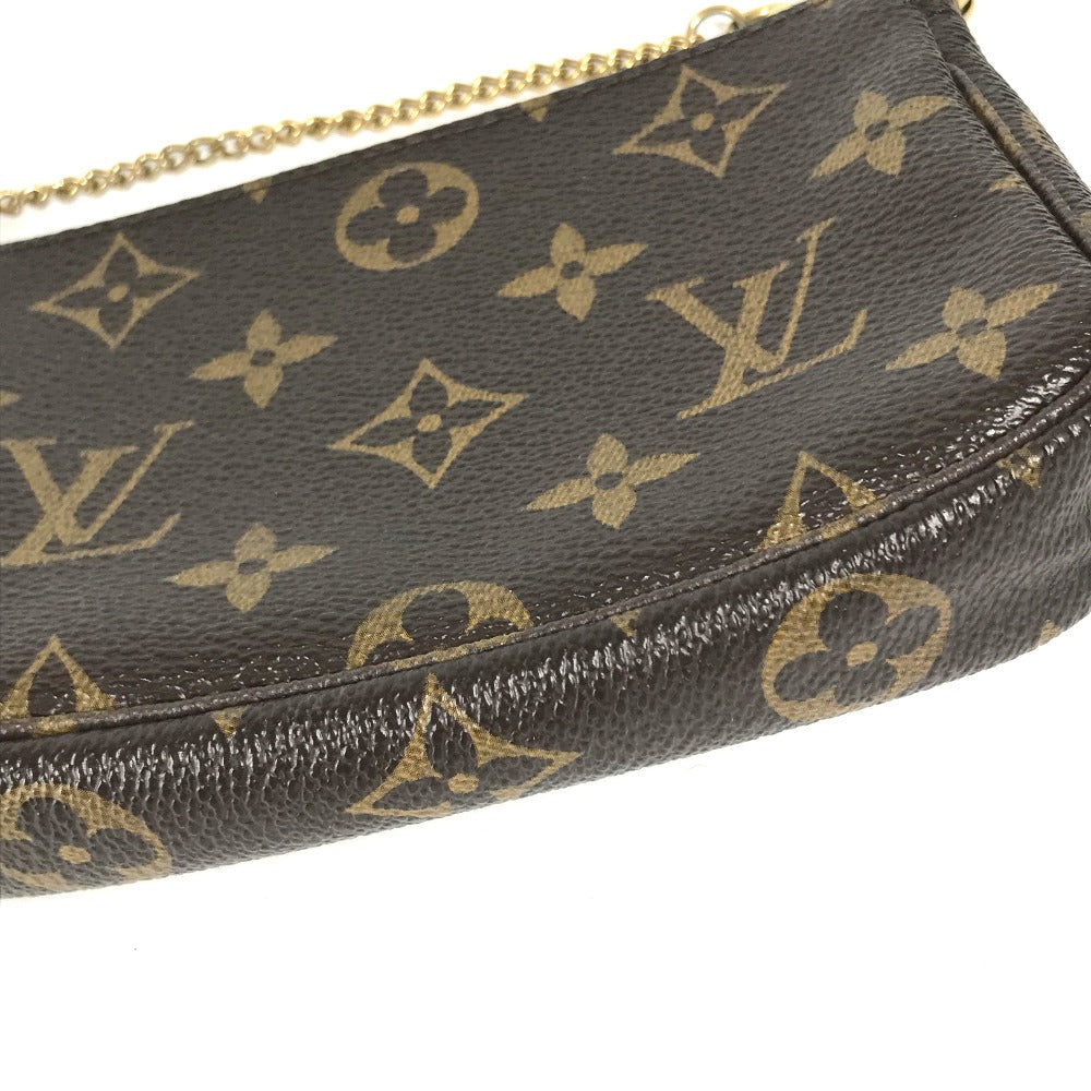 Louis Vuitton monogram handbag with gold chain on a white background
