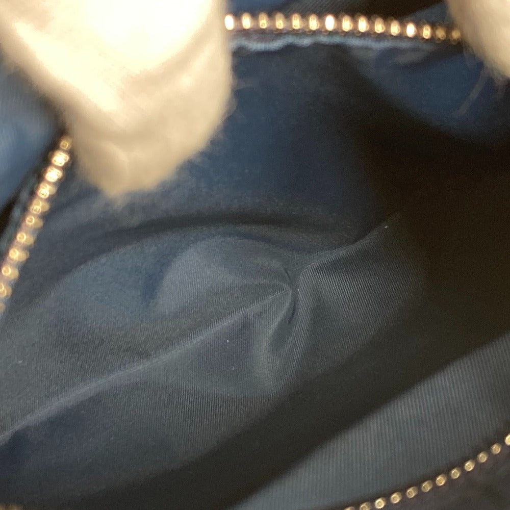 Close-up of a blue fabric with a gold zipper
