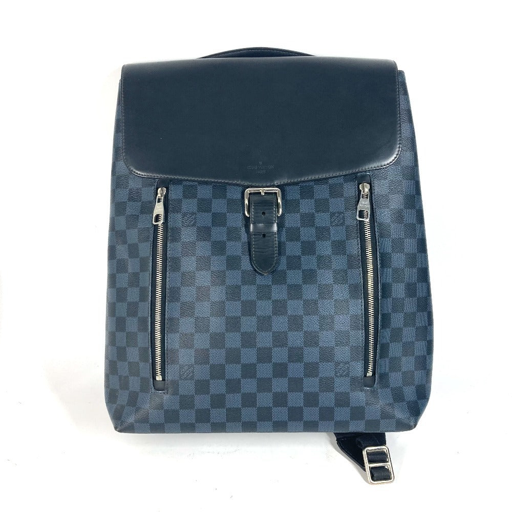 Blue checkered backpack with silver zippers on a white background