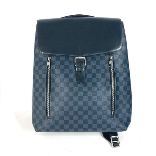 Blue checkered backpack with silver zippers on a white background