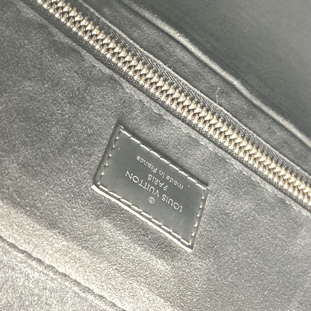 Close-up of a Louis Vuitton logo on a metallic surface