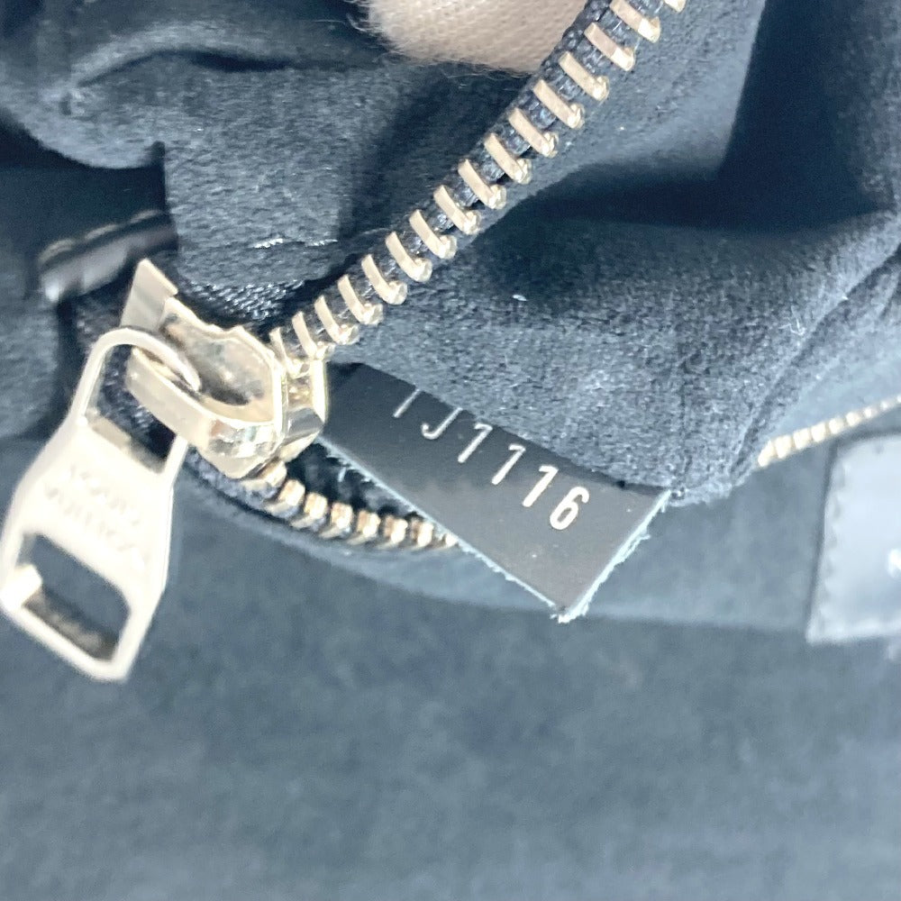 Close-up of a zipper on a dark fabric background