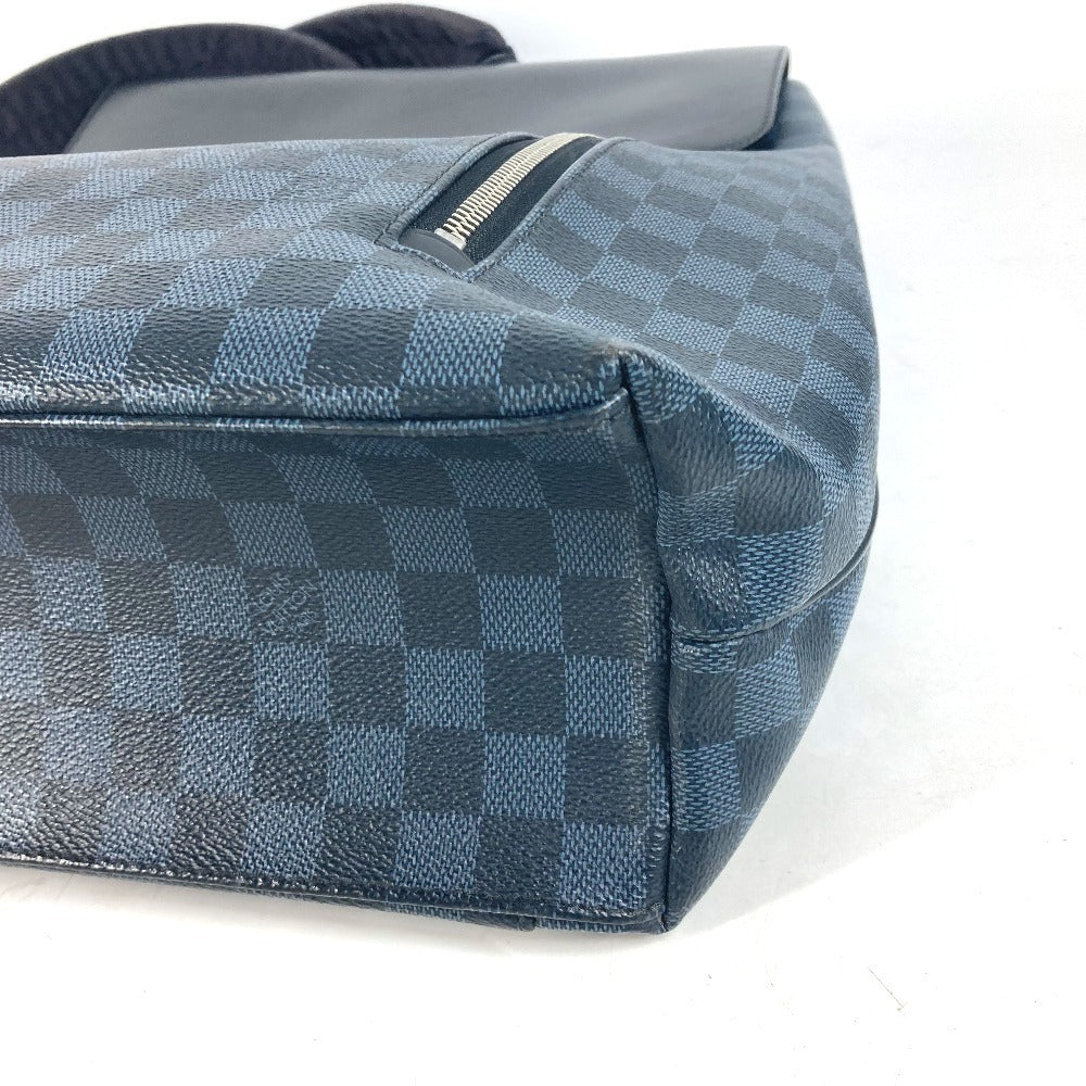 Blue checkered handbag with visible brand logo on a white background