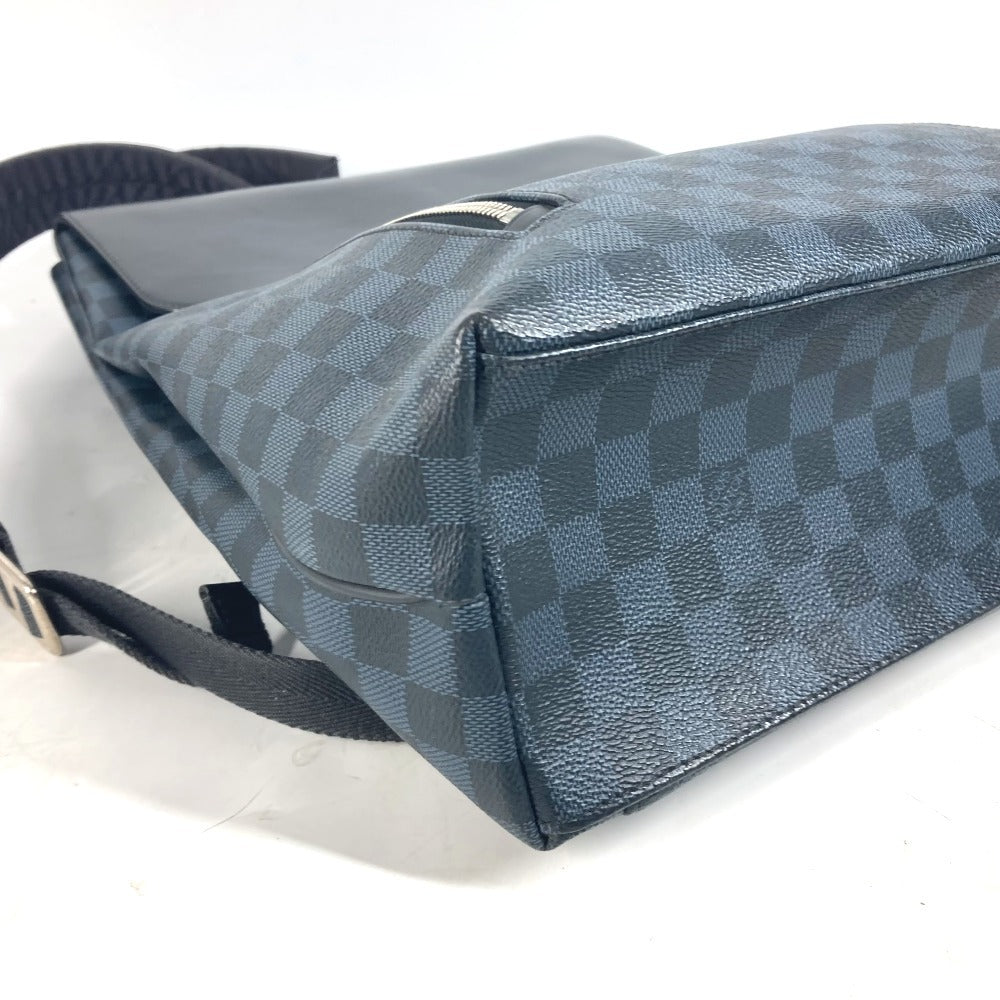 Blue checkered bag with a strap on a white background