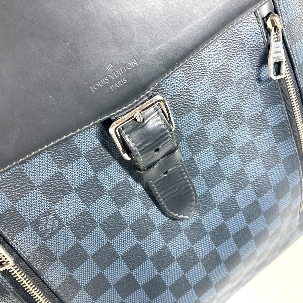 Louis Vuitton bag with checkered pattern and visible brand logo.