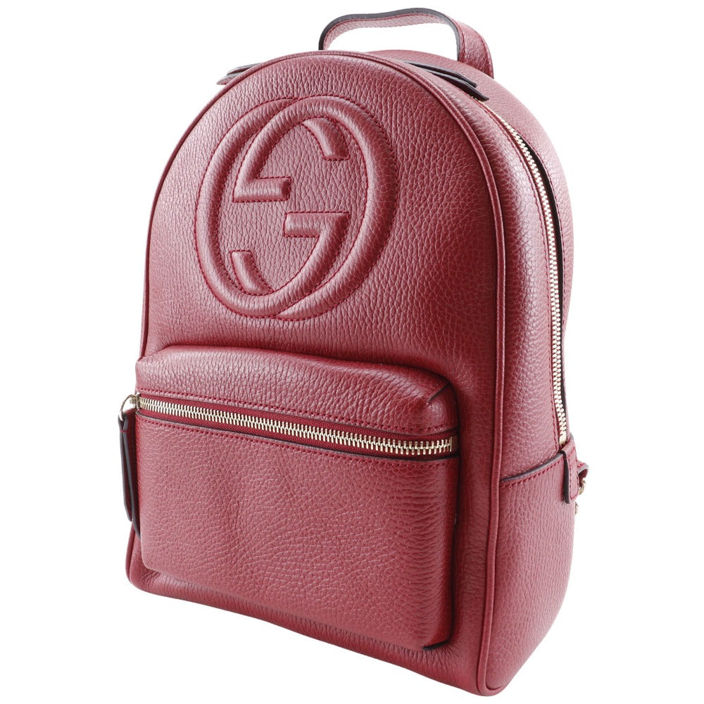 Pink backpack with a brand logo on a white background