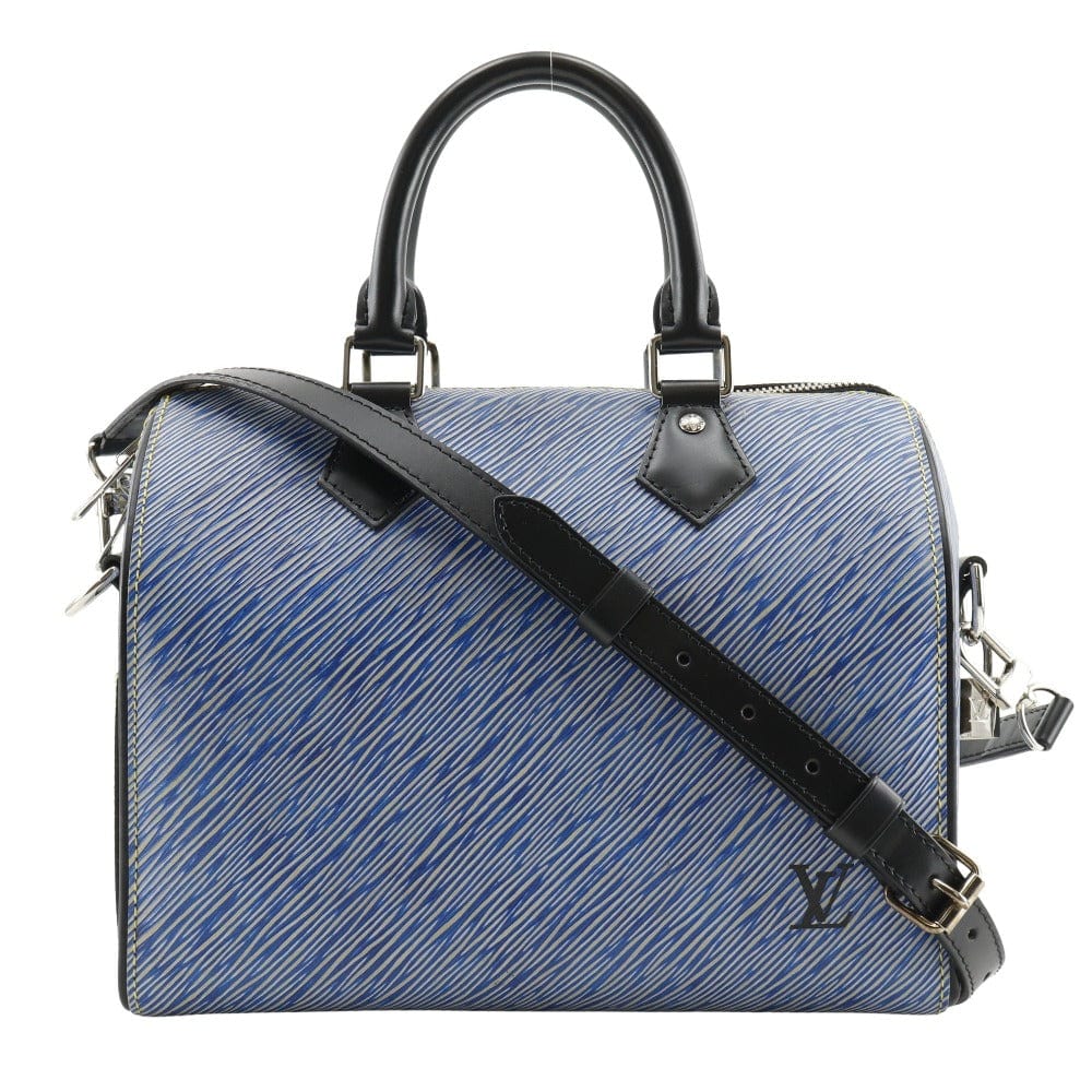 Blue handbag with black strap and handle on a white background