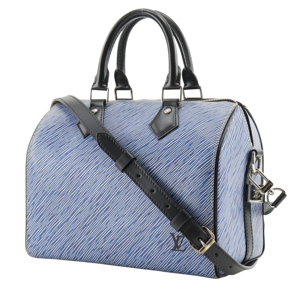 Blue handbag with black straps on a white background