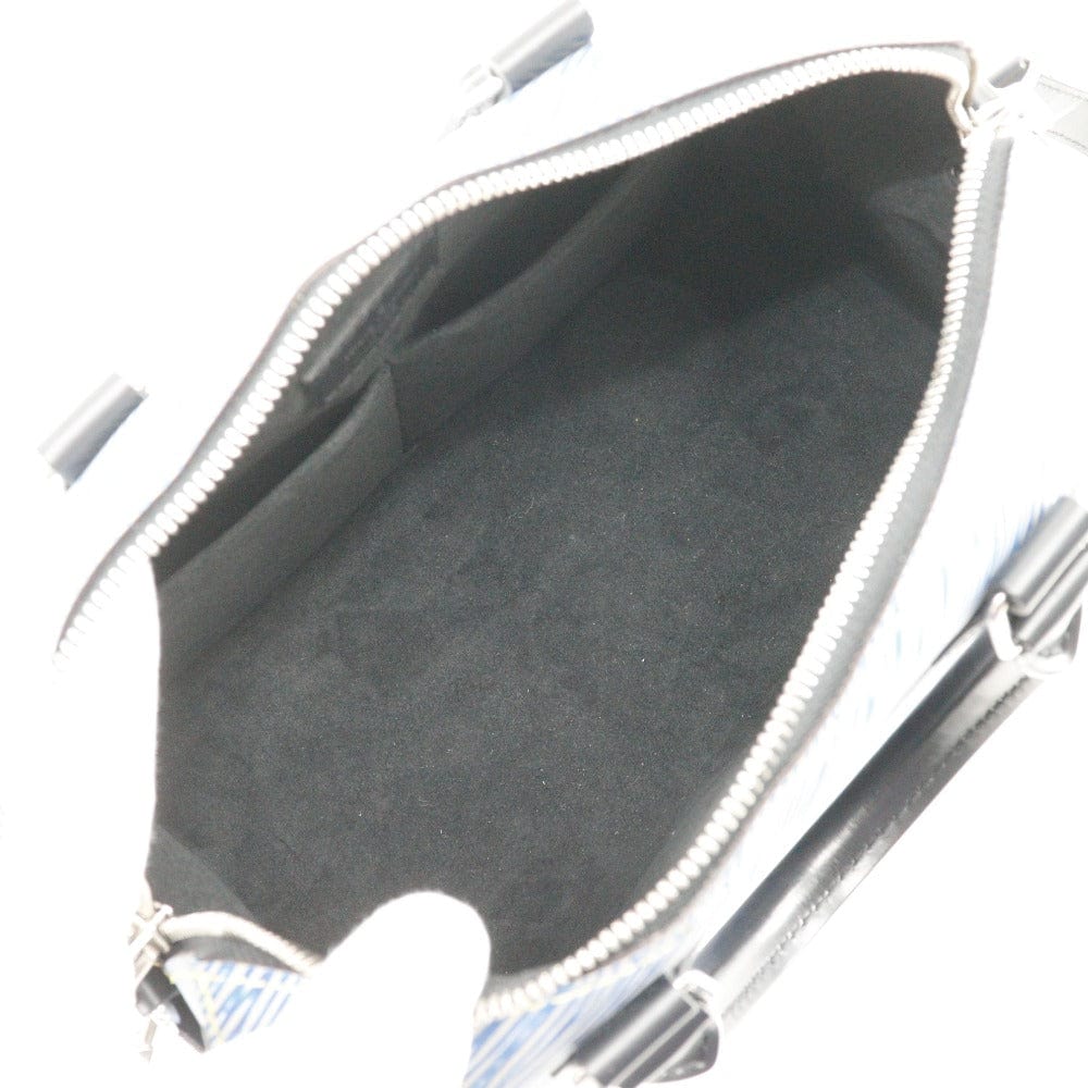 Close-up of a silver zipper with a black interior background