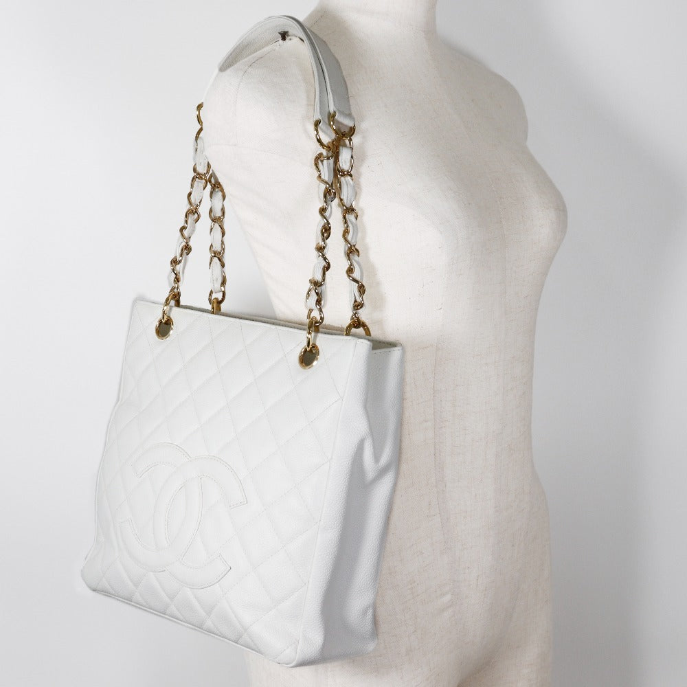 on model Chanel Quilted Caviar Leather Petit Shopping Tote White