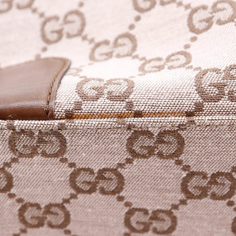 Close-up of a Gucci handbag with monogram pattern