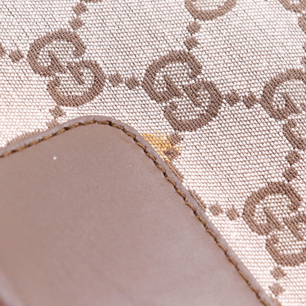 Close-up of a fabric with a pattern and a leather patch.
