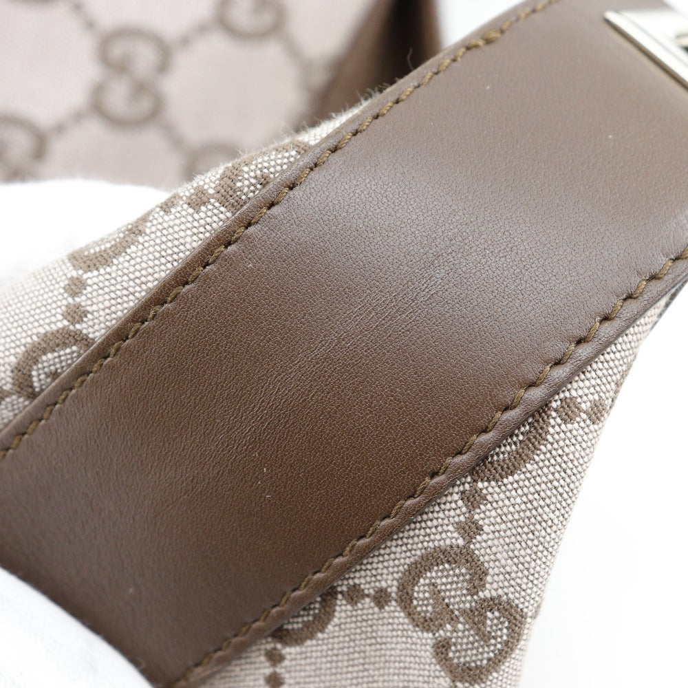 Close-up of a brown leather strap on a lace fabric background