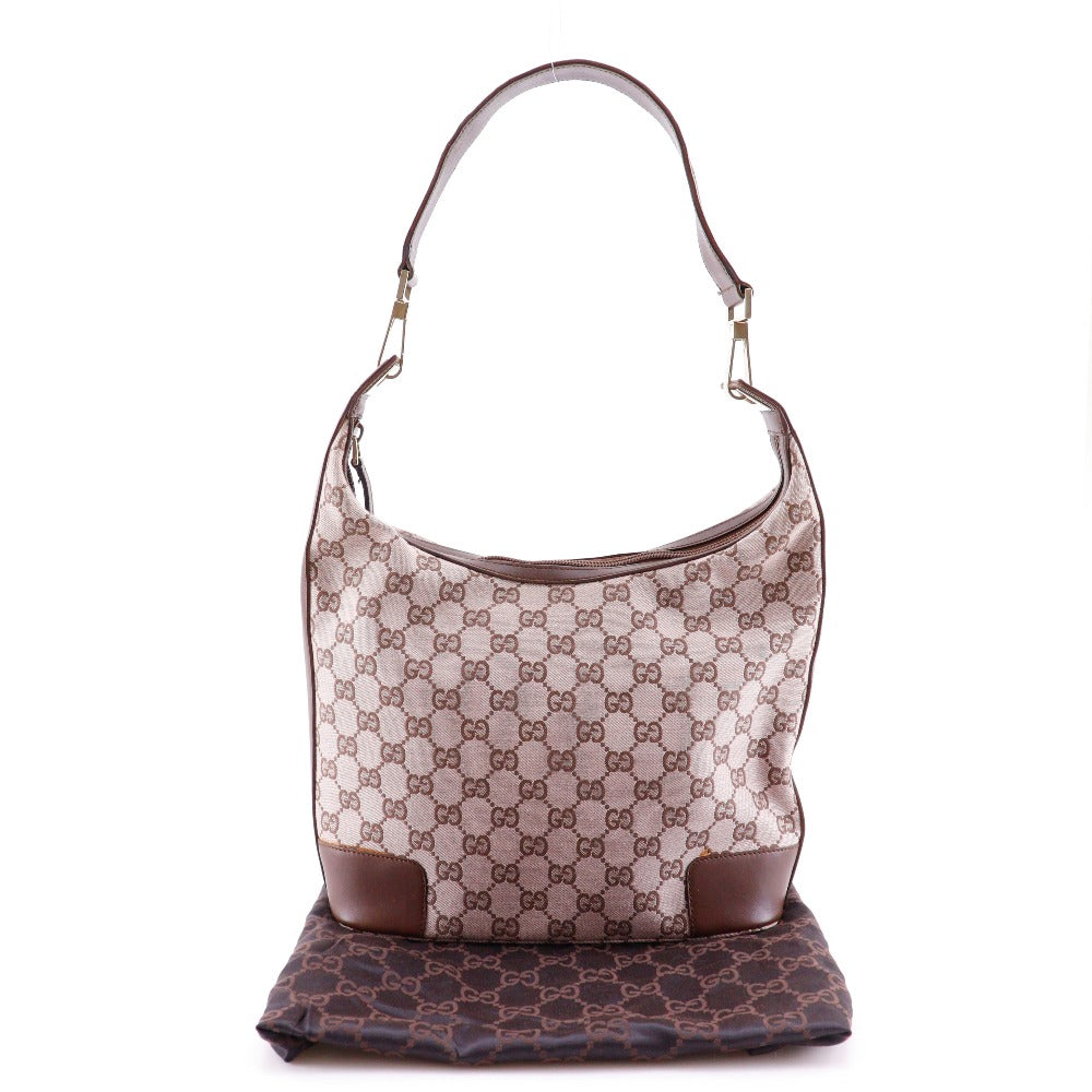 Designer handbag with monogram pattern on a white background