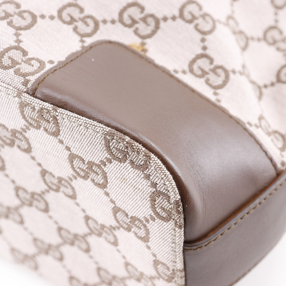 Close-up of a product with a brown cushion and patterned fabric background
