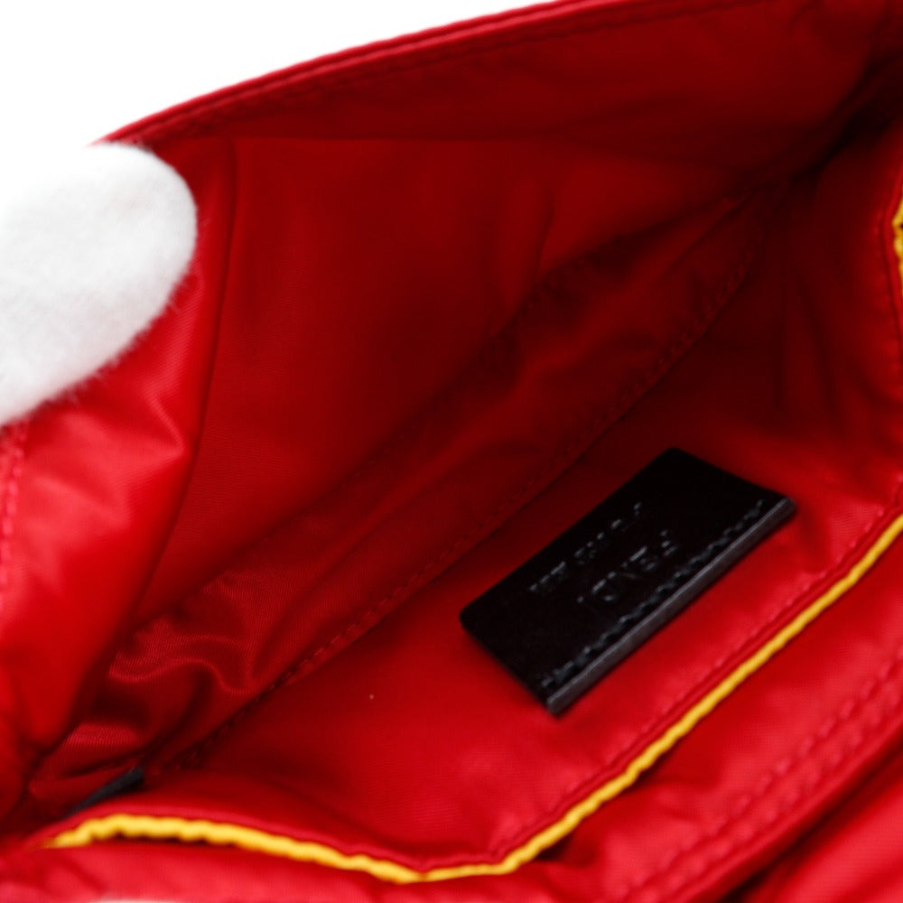 Close-up of a red jacket with a brand label on a white background