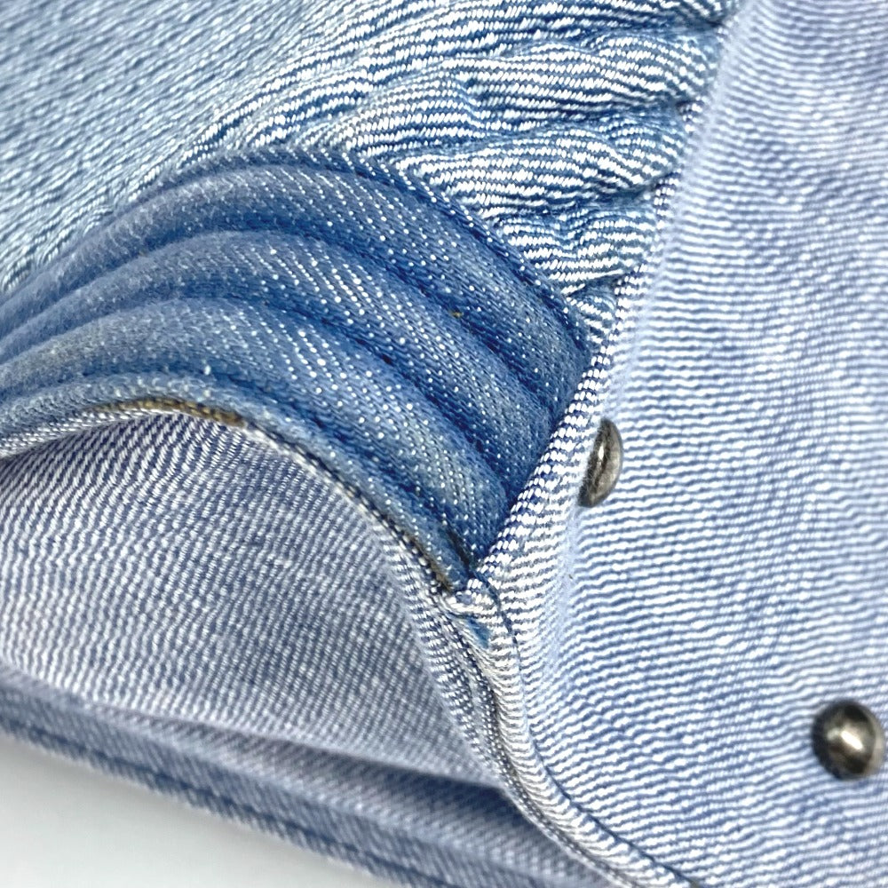 Close-up of blue denim fabric with stitching details