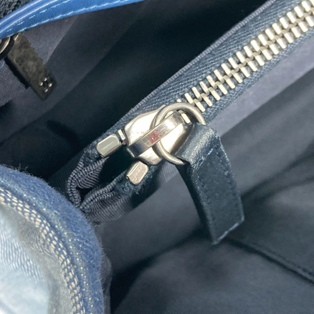 Close-up of a blue bag with a silver zipper