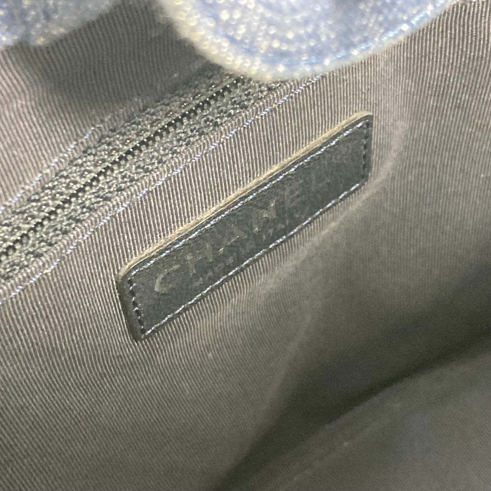 Close-up of a gray fabric with a Chanel label.