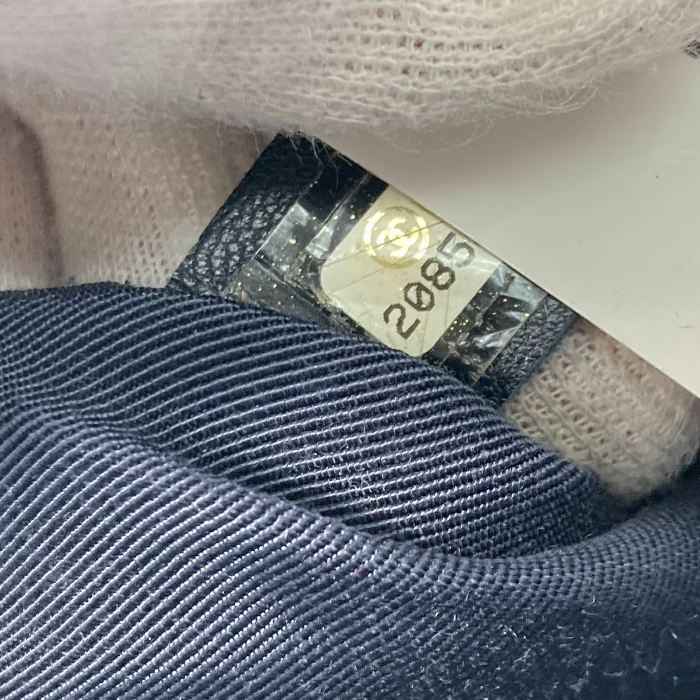 Close-up of a clothing tag on a textured fabric background