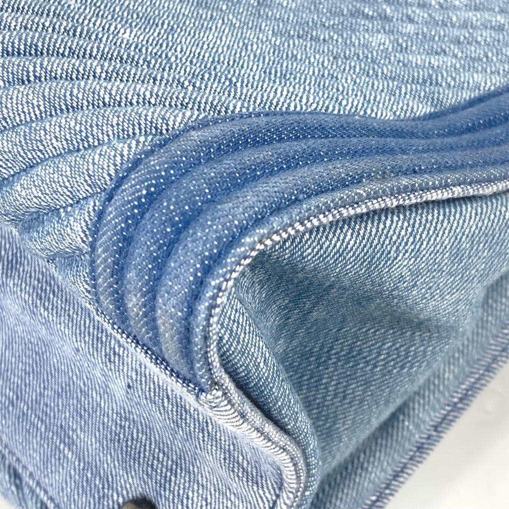 Close-up of blue denim fabric with a white background