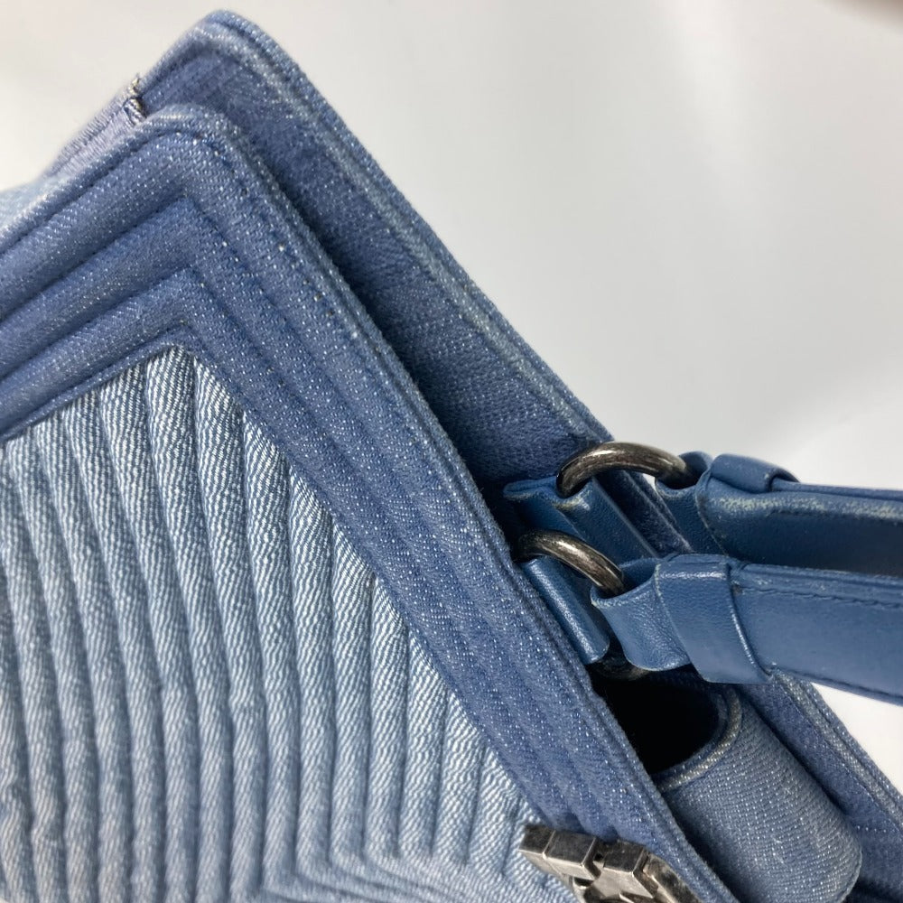 Close-up of a blue textured bag with a strap on a white background