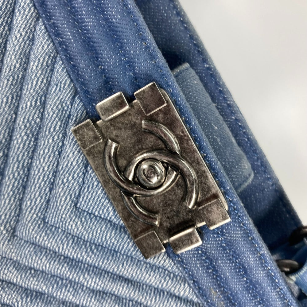 Metallic clasp on a blue denim fabric background