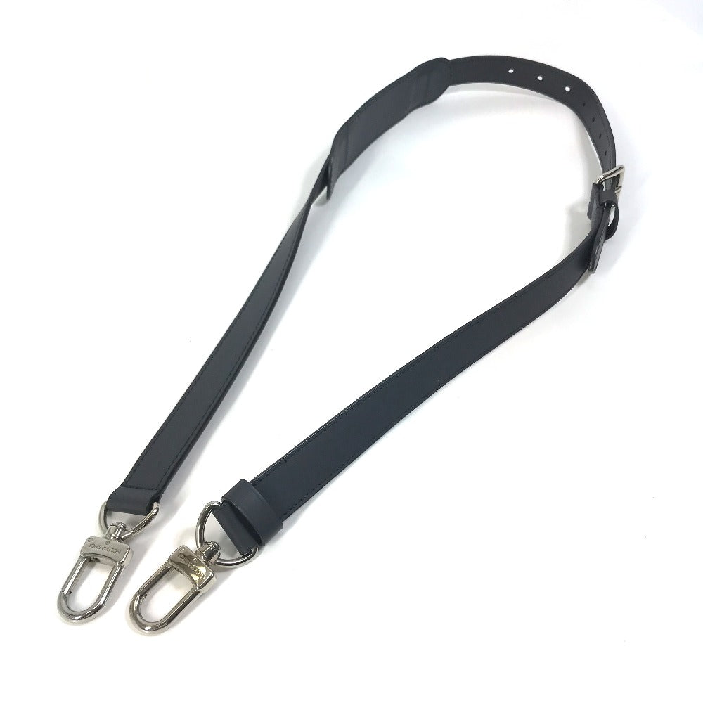 Black strap with metal hooks on a white background